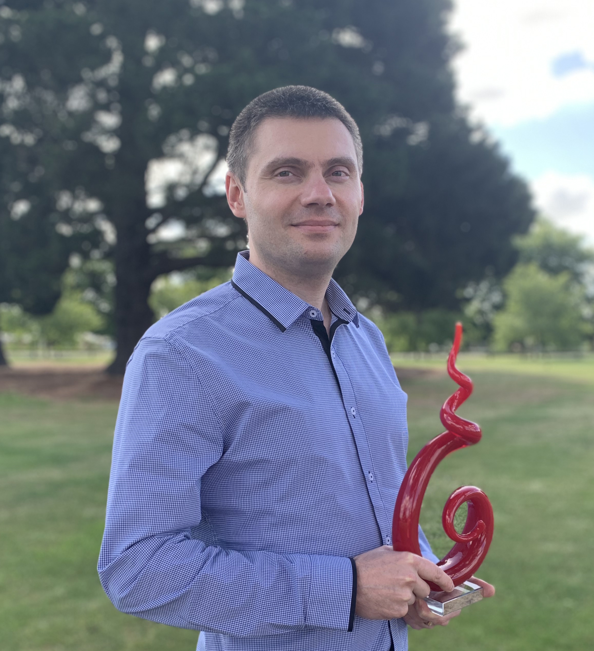 Dr Alex Filkov (University of Melbourne) with his Early Career Award in Fire Science.