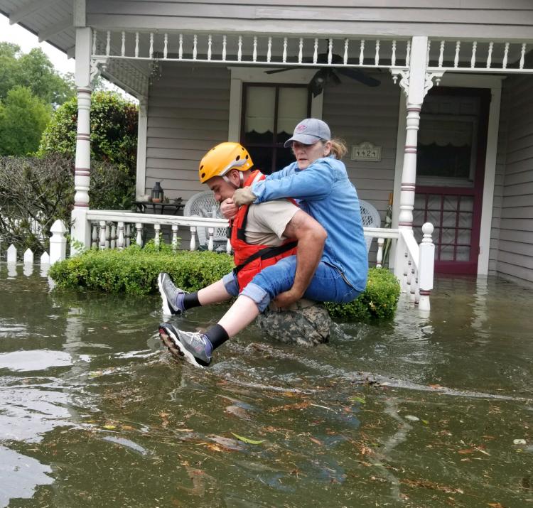 Texas National Guard rescuing a Houston resident during Hurricane Harvey. Photo Texas National Guard CC BY 2.0 
