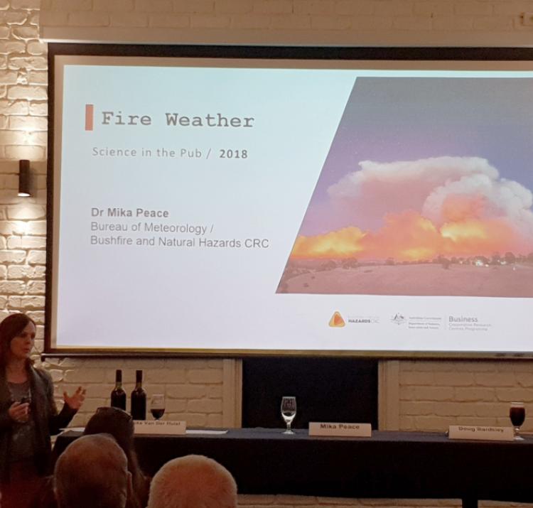 Dr Mika Peace presents her fire research at a pub in Adelaide.
