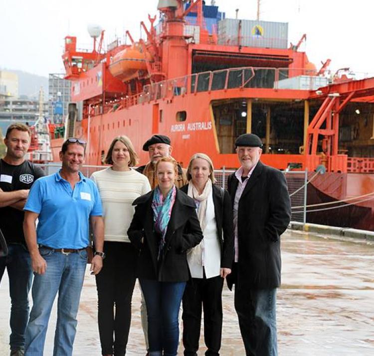 PhD students with the Aurora Australis in Hobart.