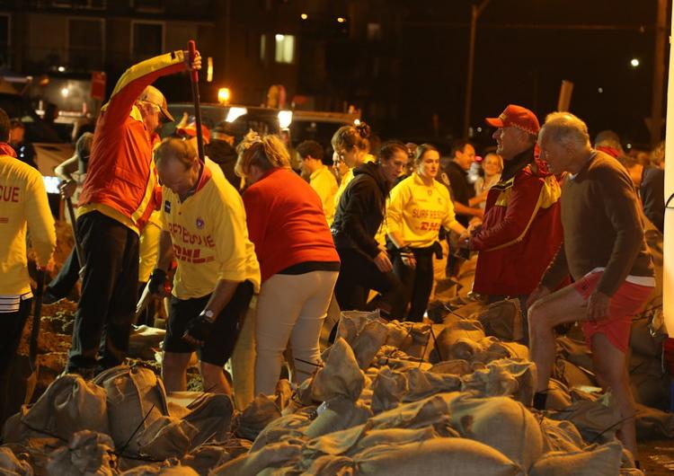 Residents, community members and emergency services sand bagging at Collaroy 2016. Photo: NSW RFS