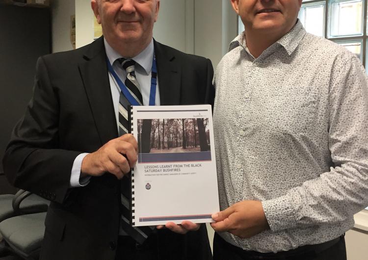 Doug Hart (left) was acknowledge for his Black Saturday report by the chair of the AFAC Community Safety Group Andrew Stark.