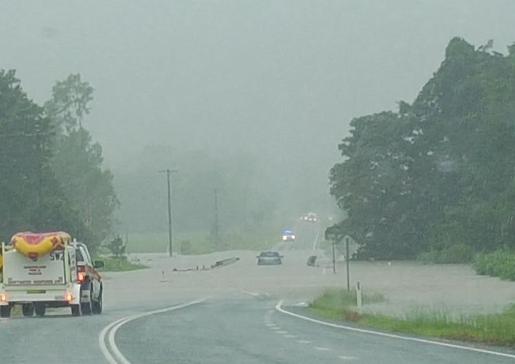 The SES getting ready to rescue a driver stuck on a flooded bridge. Photo: Davina Pearson