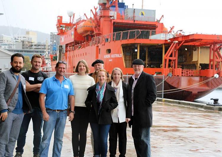 PhD students with the Aurora Australis in Hobart.