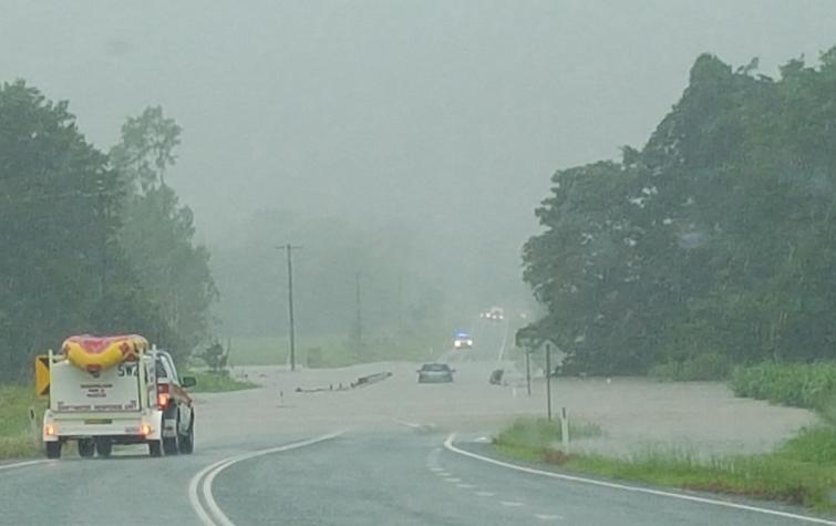 The SES getting ready to rescue a driver stuck on a flooded bridge. Photo: Davina Pearson