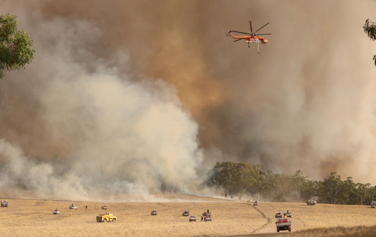 An Erickson Aircrane and fire units battle the Bangor fire in January 2014. Photo by Tait Schmall/Newscorp
