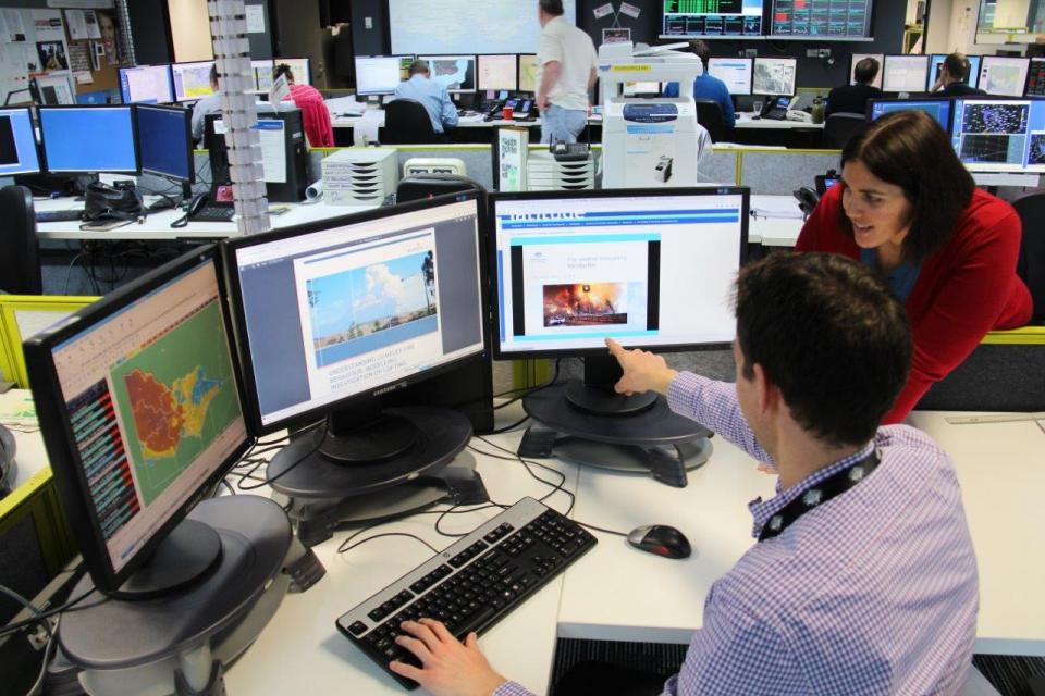 Fire weather forecaster Steven McGibbony uses the Spot Fire Forecasting course online from the Victorian Regional Forecasting Centre with Fire Weather Training Program Manager, Monica Long.