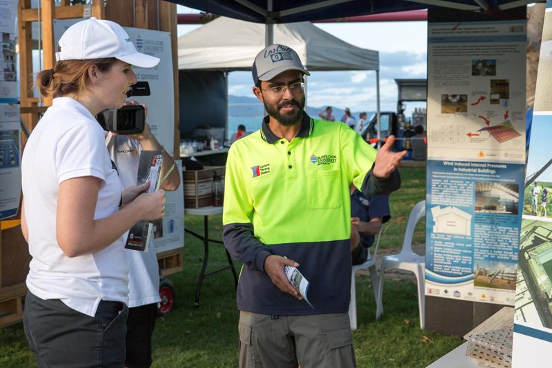 PhD researcher Korah Parackal talks about his research at a cyclone awareness day in Townsville.