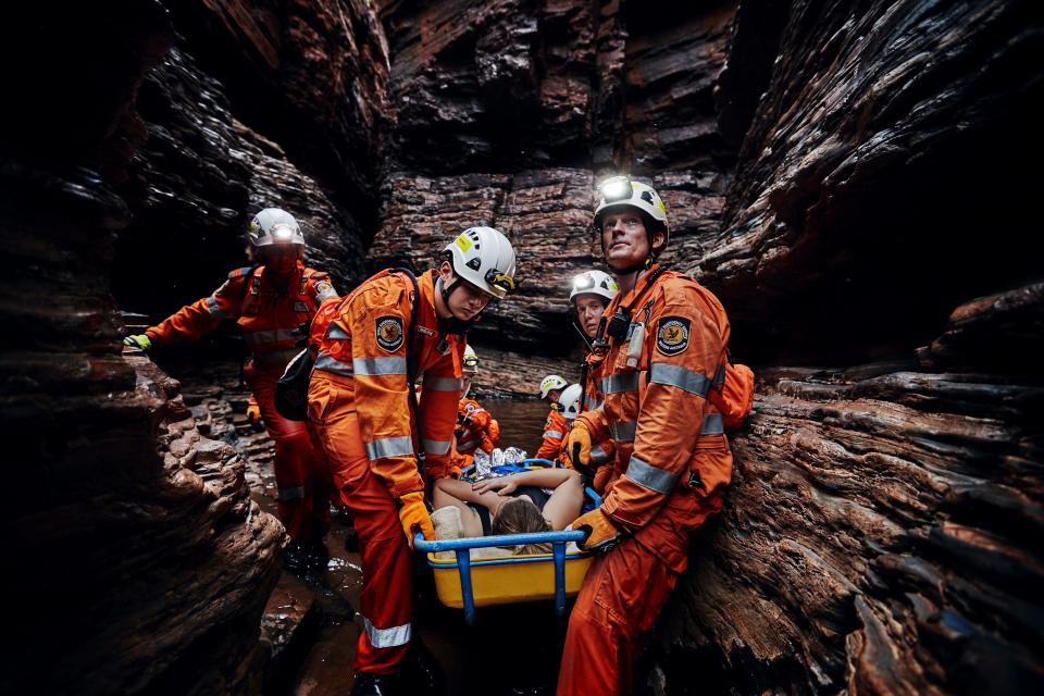 A crew of State Emergency Service volunteers perform a cave rescue.