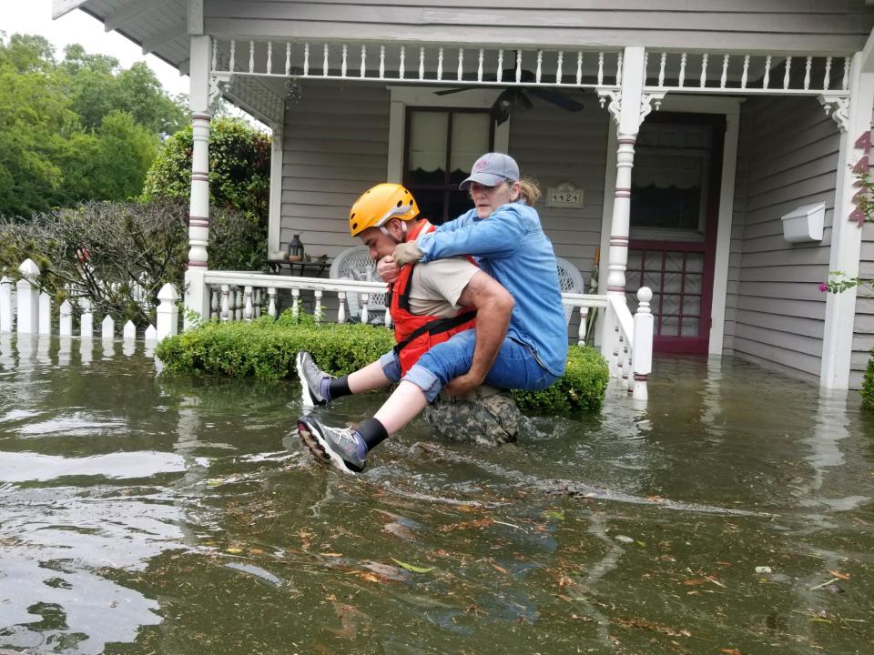 Texas National Guard rescuing a Houston resident during Hurricane Harvey. Photo Texas National Guard CC BY 2.0 
