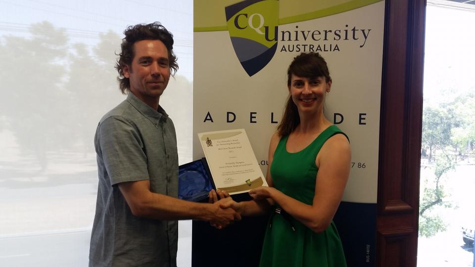 CRC researcher, Dr Kirrilly Thompson receiving her award from CQUniveristy