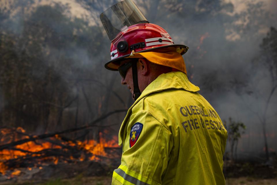 Image of a firefighter during the 2018 Queensland bushfires. Photo: Queensland Fire and Emergency Service.